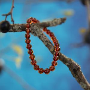 Bracelet made of perfect beads JANTAR - cognac colour clear