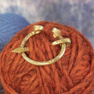 Larger omego buckle with hand wrought pattern for sheaths