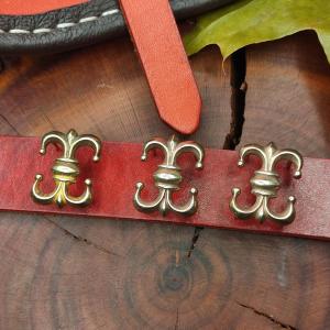 Dekorative Gürtelbeschläge aus Messing Clown