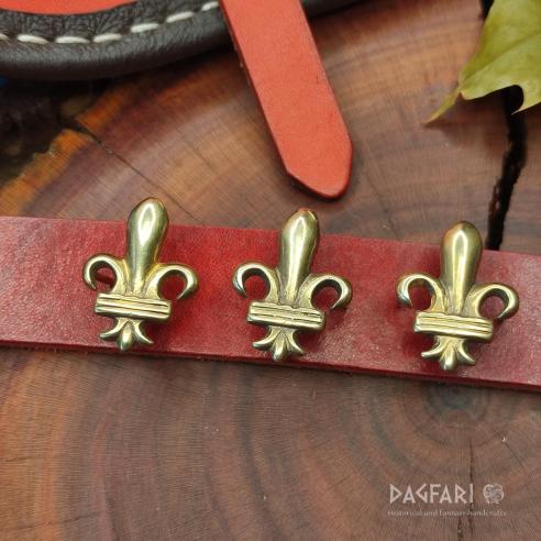 DECORATIVE BELT MOUNTS High medieval Brass decorative belt fittings Lily