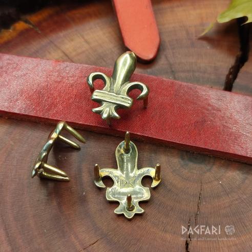 DECORATIVE BELT MOUNTS High medieval Brass decorative belt fittings Lily